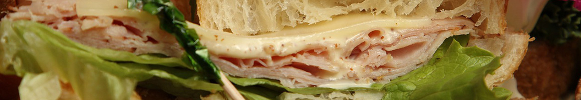 Eating Deli Sandwich at Carthage Junction Deli restaurant in Carthage, MS.